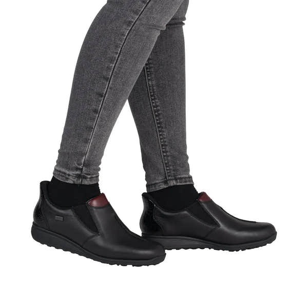 Rieker 47253-00 Ready2Go women's black leather water-resistant slip-on shoes with padded collar and flexible sole.