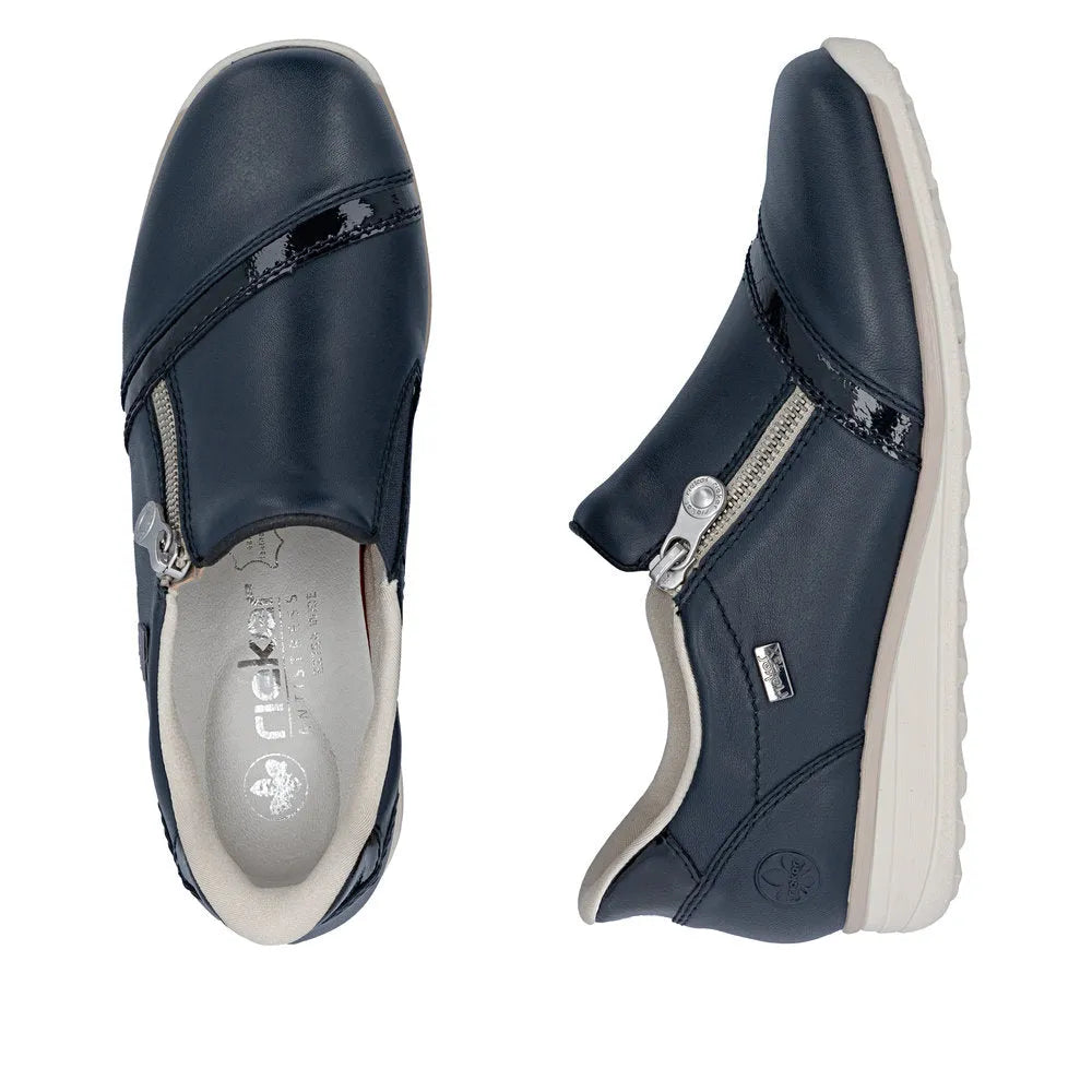 Rieker 47264-14 women's navy water-resistant leather side zip shoes with wide fit and white soles.