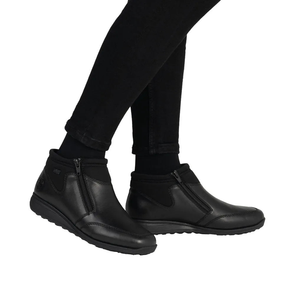 Rieker 47270-00 women's black leather water-resistant twin zip ankle boots with cushioned sole and stylish design.