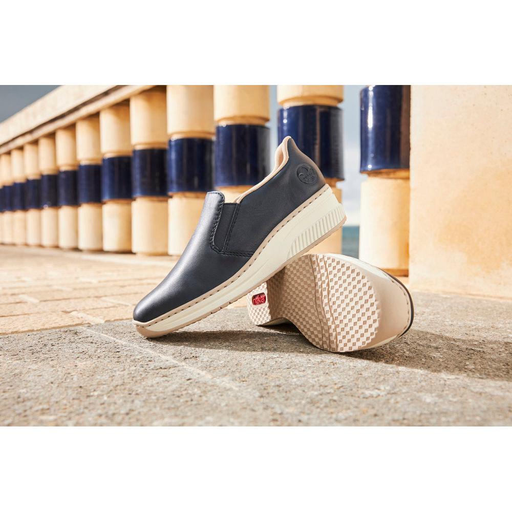 Rieker 48761-14 Ladies Pacific Leather Slip-On Shoes, black casual loafers with cushioned sole and beige accents.