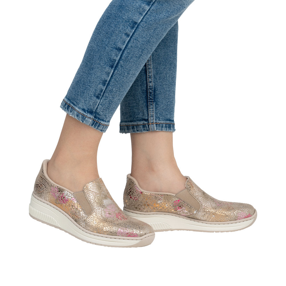 Rieker 48761-90 women's slip-on shoes with beige metallic sequined design, comfortable sole, and casual style.