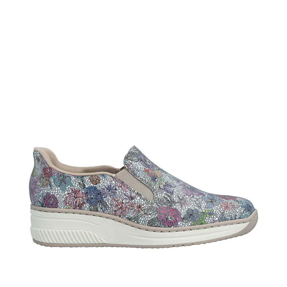 Rieker 48761-91 ladies multi-colored leather elasticated slip-on shoes with a white sole and lace-like floral pattern.