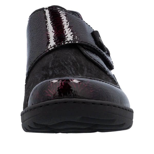 Rieker 48951-35 women's red touch fastening shoes with shiny patent and matte black panels, cushioned sole, and slip-on design.