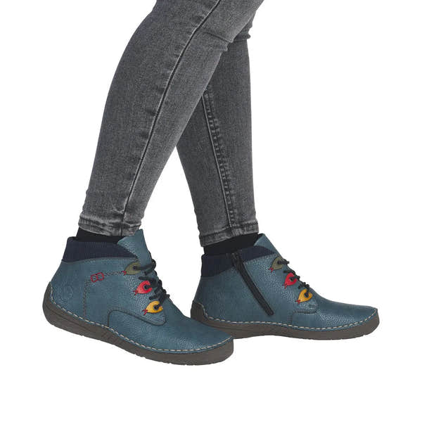 Rieker 52544-14 women's blue ankle boots with zip and lace detail, featuring colorful eyelets and a side zipper.