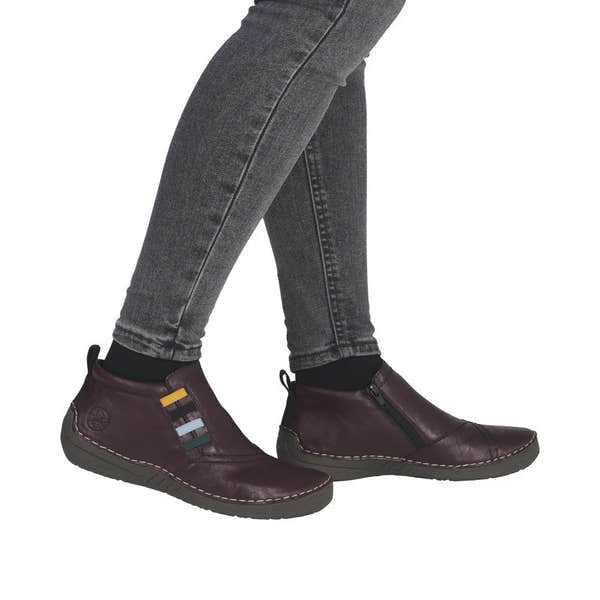 Rieker 52584-30 women's red ankle boots with side zipper, leather upper, and slip-on design.