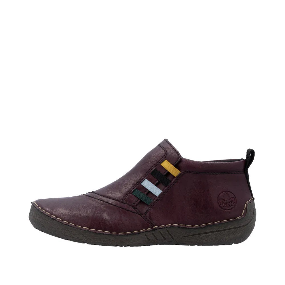 Rieker 52584-30 women's burgundy ankle boots with side zip, leather upper, cushioned sole, and multi-color side detailing.