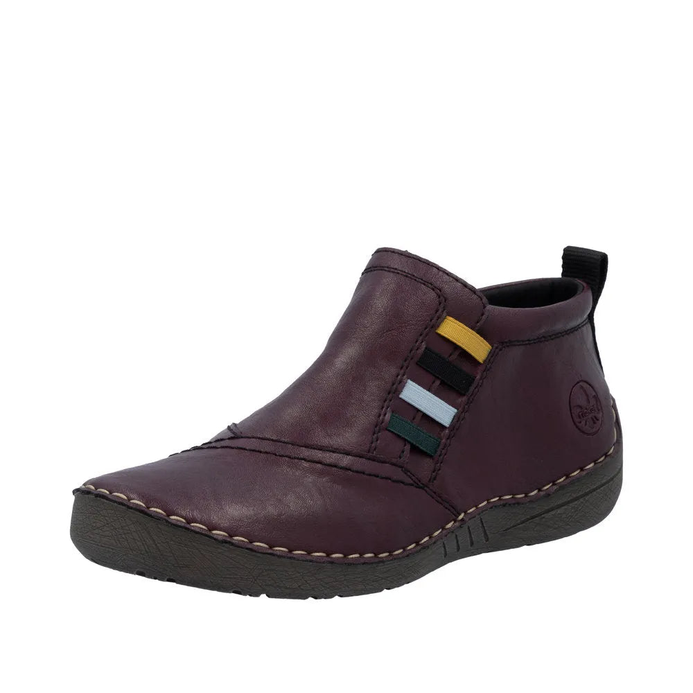 Rieker 52584-30 women's red ankle boots with side zipper, leather upper, slip-on design, and multi-color strap details.