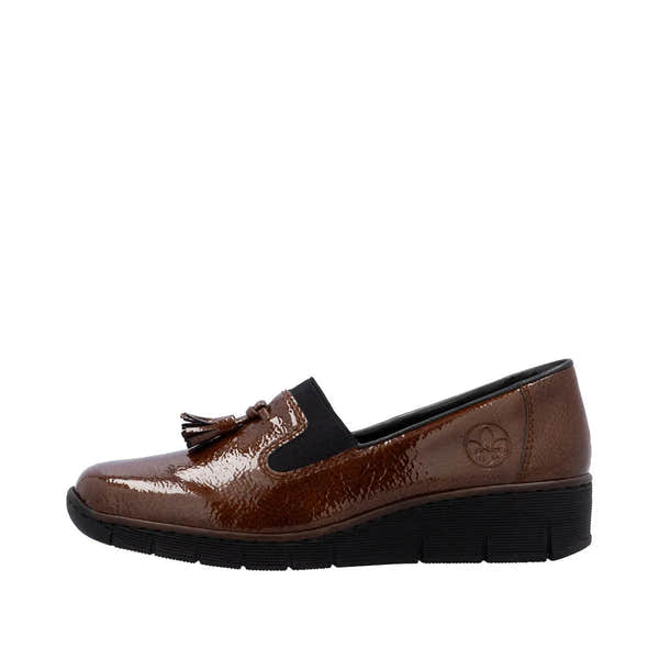 Rieker 53751-24 women's brown slip-on shoes with glossy finish, tassel detail, and black elastic side panel, cushioned sole and low wedge heel.
