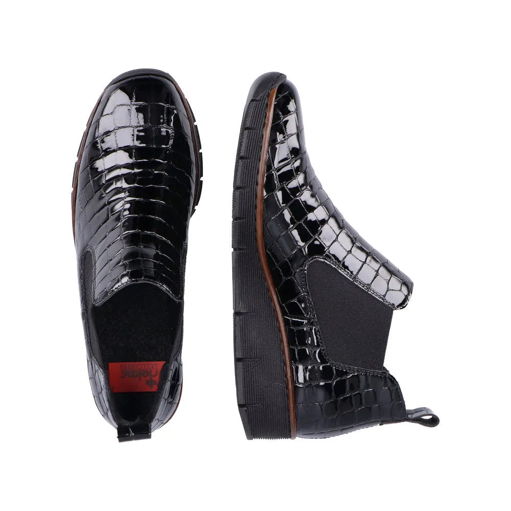 Rieker 53794-01 women's black croc leather pull-on ankle boots with chunky soles and elastic side panels.