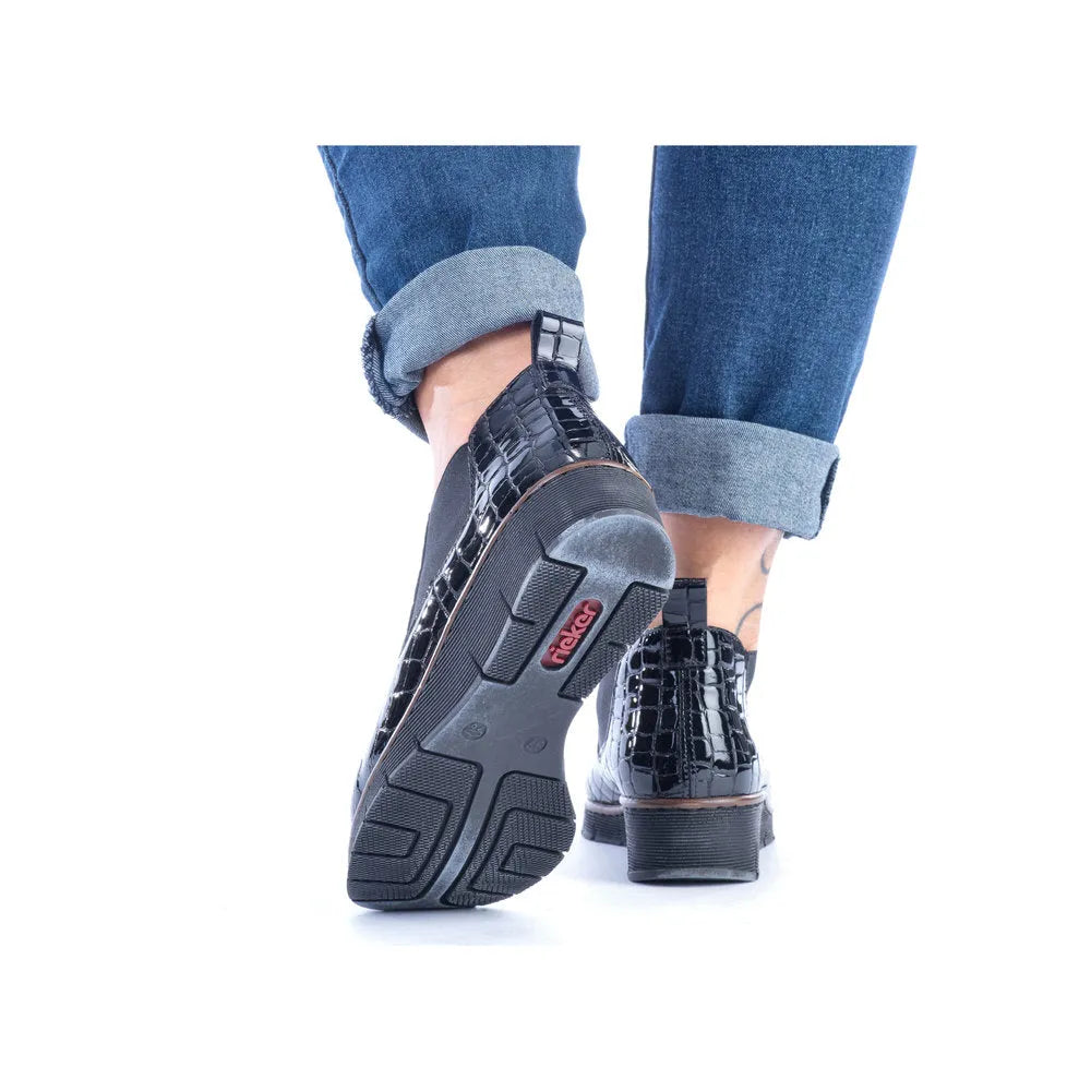 Rieker 53794-01 women's black croc leather pull-on ankle boots with chunky heels and slip-resistant soles.