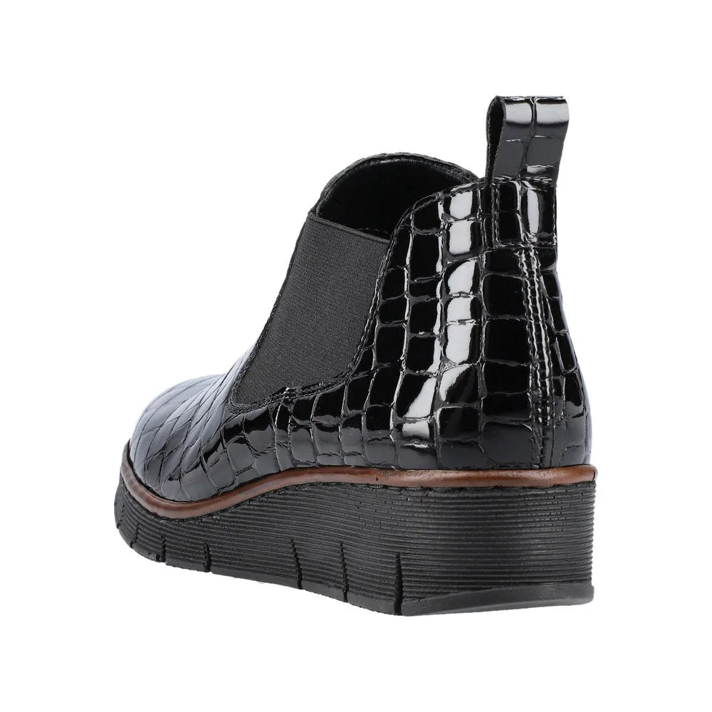 Rieker 53794-01 women's black crocodile leather pull-on ankle boots with low wedge heel and slip-on design.