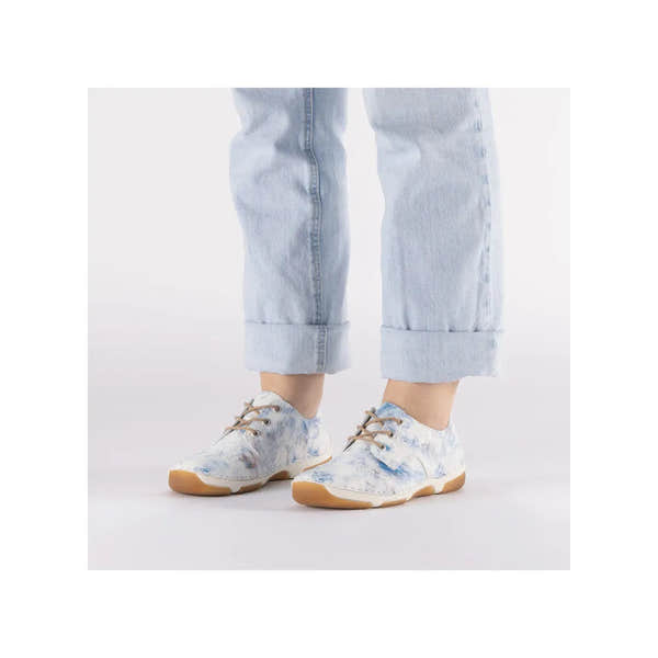 Rieker 55920-90 women's blue multi lace-up sneakers with floral print and beige soles.