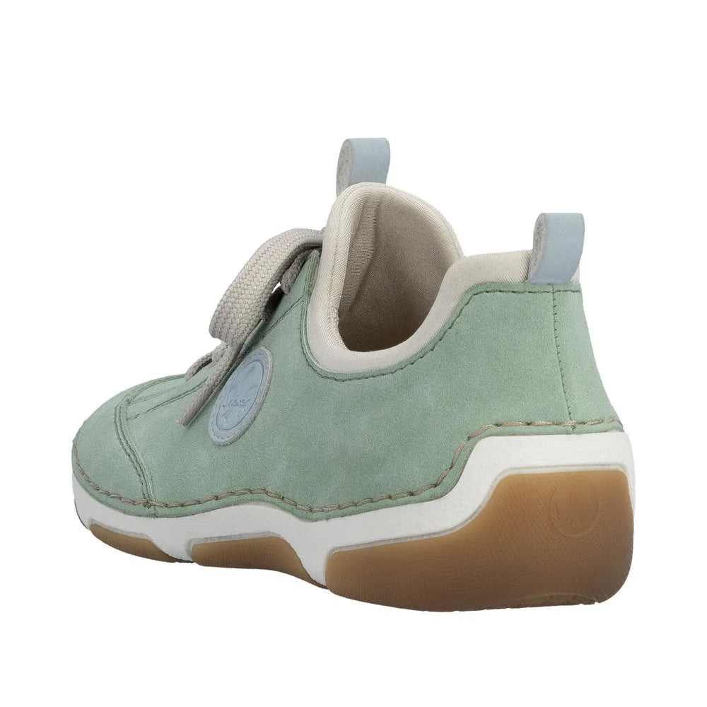 Mint green lace-up shoes with beige lining, white midsole, and gum rubber sole, featuring a small logo patch and pull tabs.