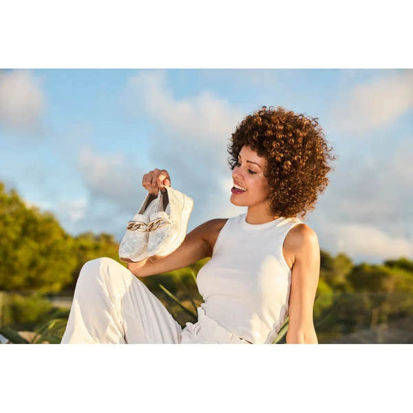 Rieker 58944-61 ladies beige slip-on shoes with chain detail, lightweight and comfortable for casual wear.