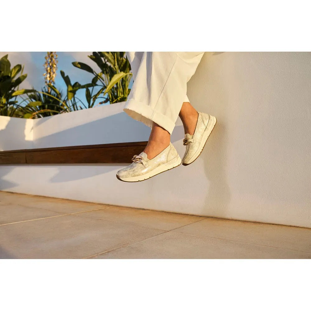 Rieker 58944-61 beige slip-on women’s shoes with bow detail, comfortable casual footwear for spring and summer.