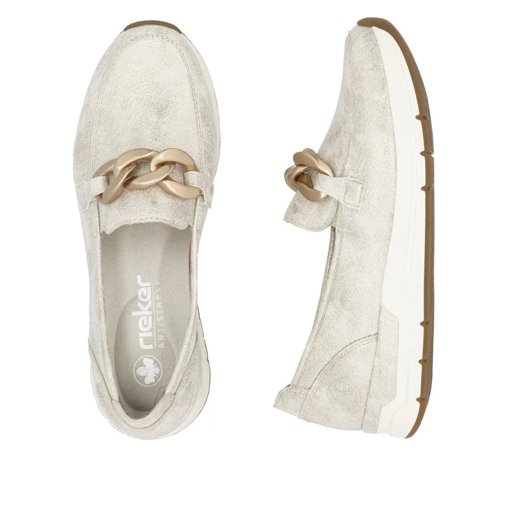 Rieker 58944-61 beige slip-on women's shoes with chain detail and comfortable sole.