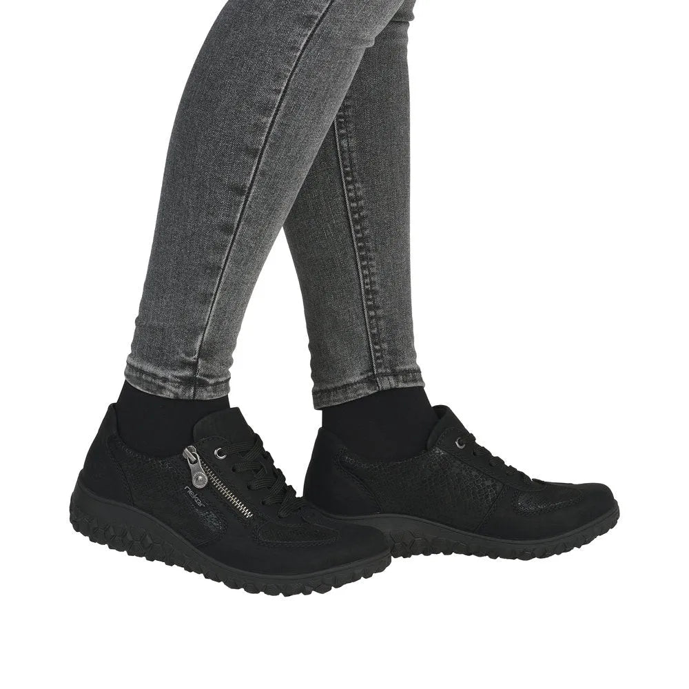 Rieker 59501-00 women's black zip and lace trainers with textured detailing and cushioned soles.