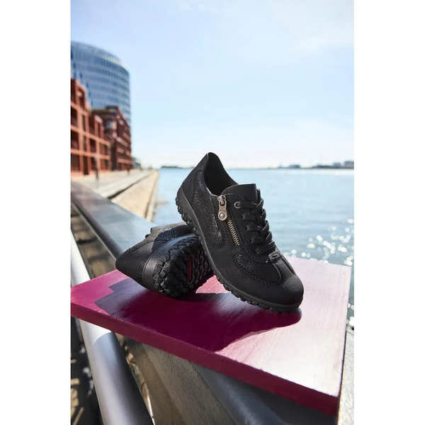 Rieker 59501-00 women's black lace-up trainers with side zippers, rugged sole, and stylish design, perfect for casual wear.