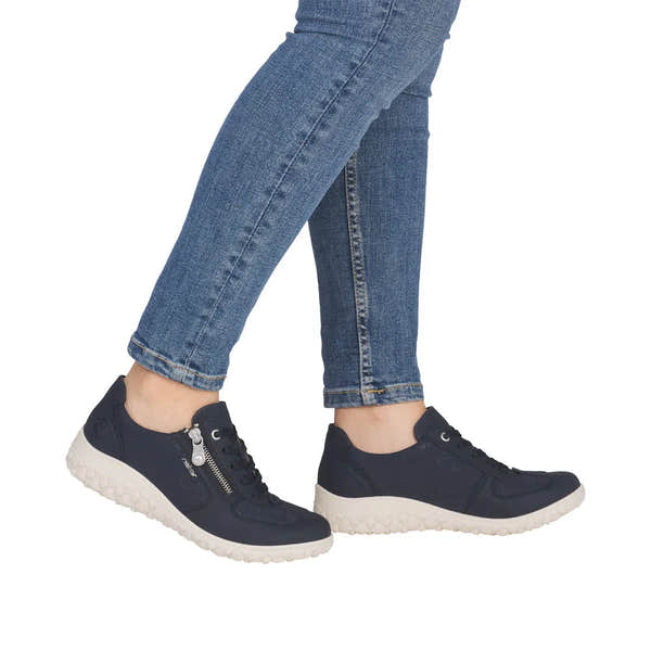 Rieker 59501-14 women's wide navy/black zip and lace shoes with textured white soles, denim jeans.