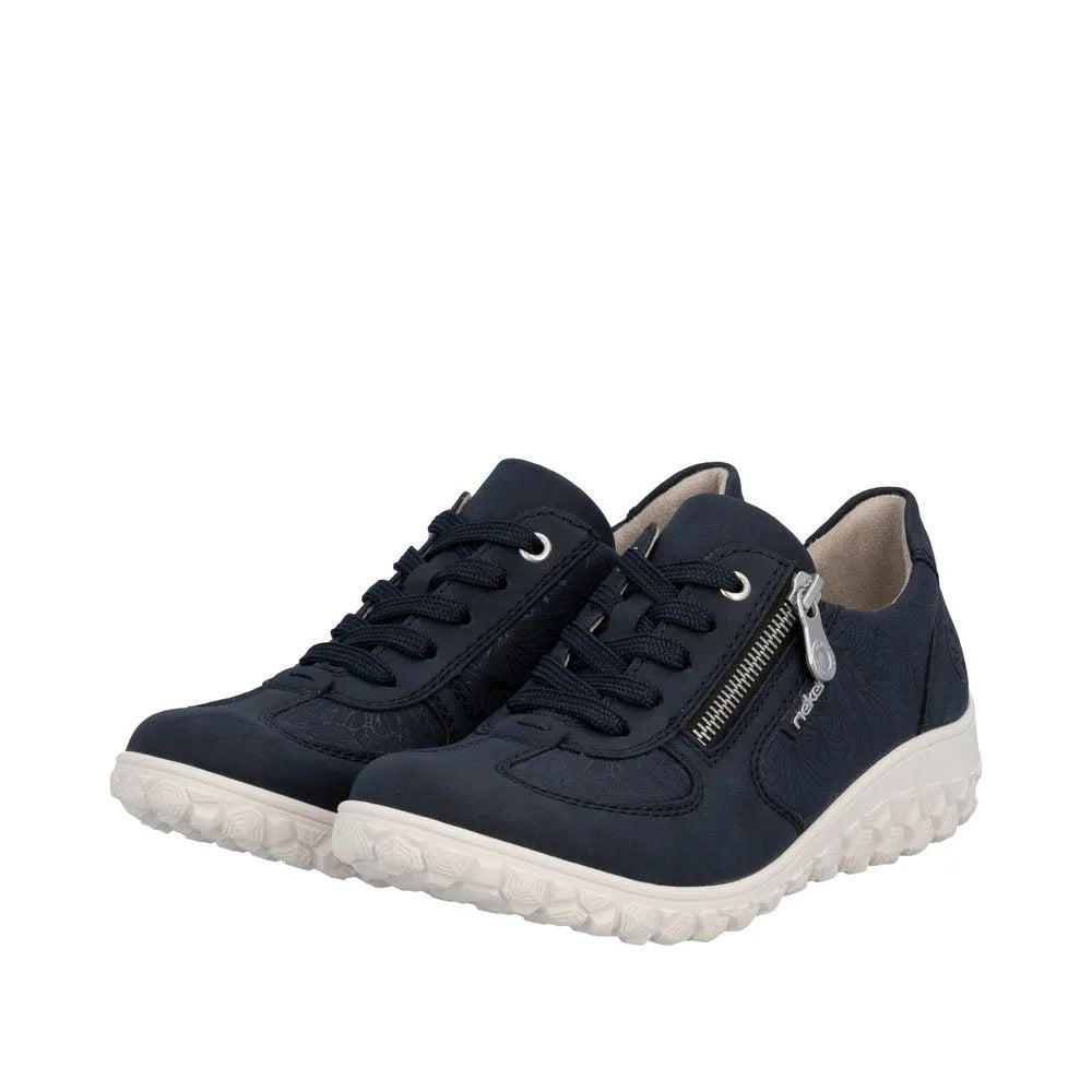 Rieker 59501-14 women's wide-fit navy shoes with lace-up front, side zipper, floral pattern, and white rubber sole.