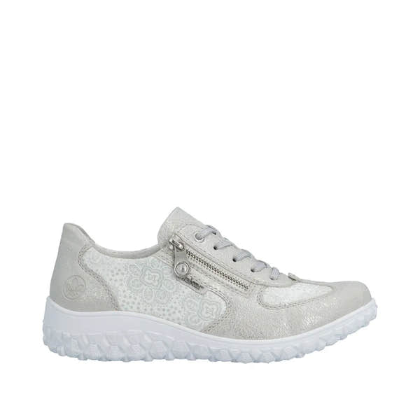 Rieker 59501-90 women's wide fit white and silver lace-up shoe with side zipper, floral pattern, textured sole, and metallic accents.
