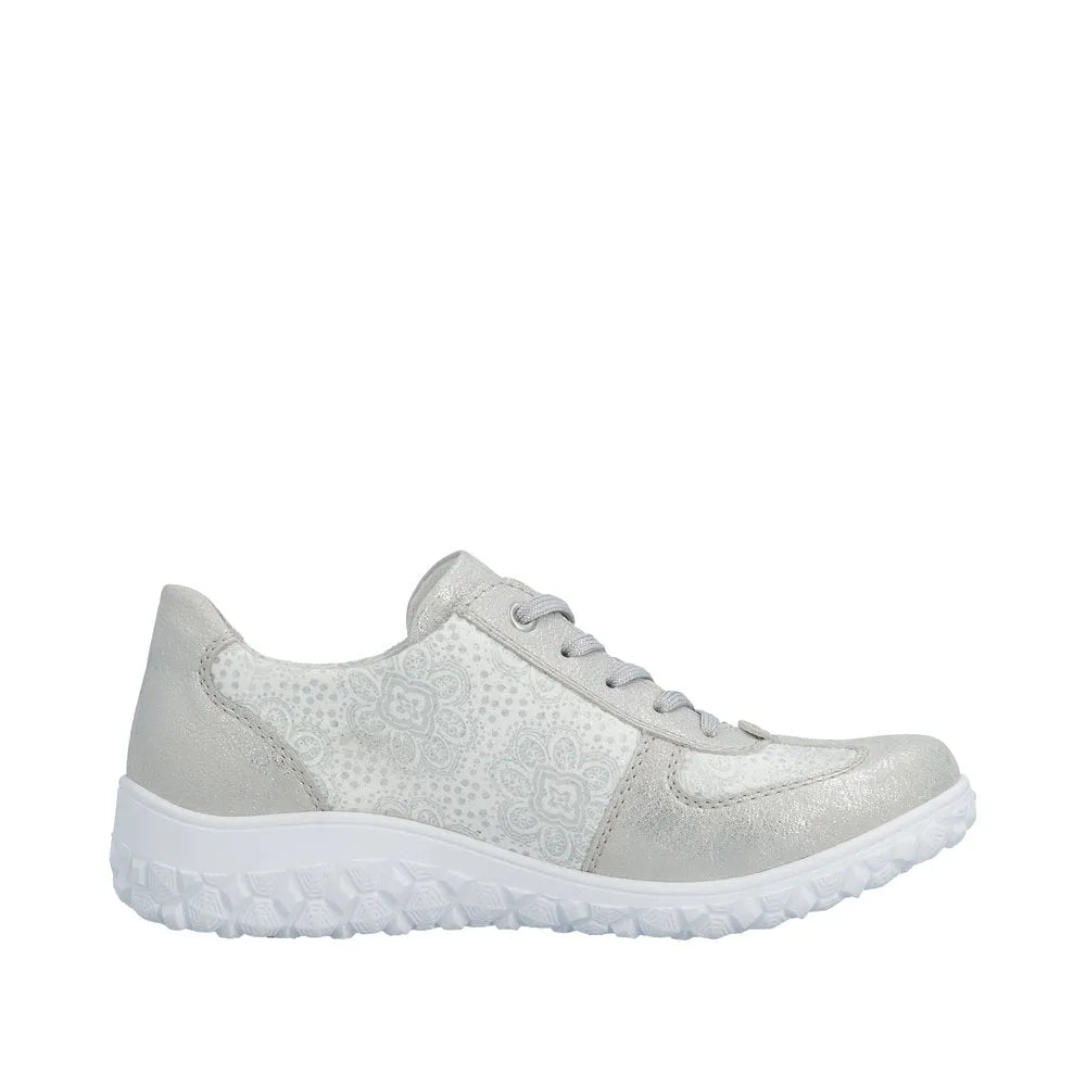Rieker women's wide white lace-up shoe with silver accents, floral pattern, zip and lace closure, textured sole.
