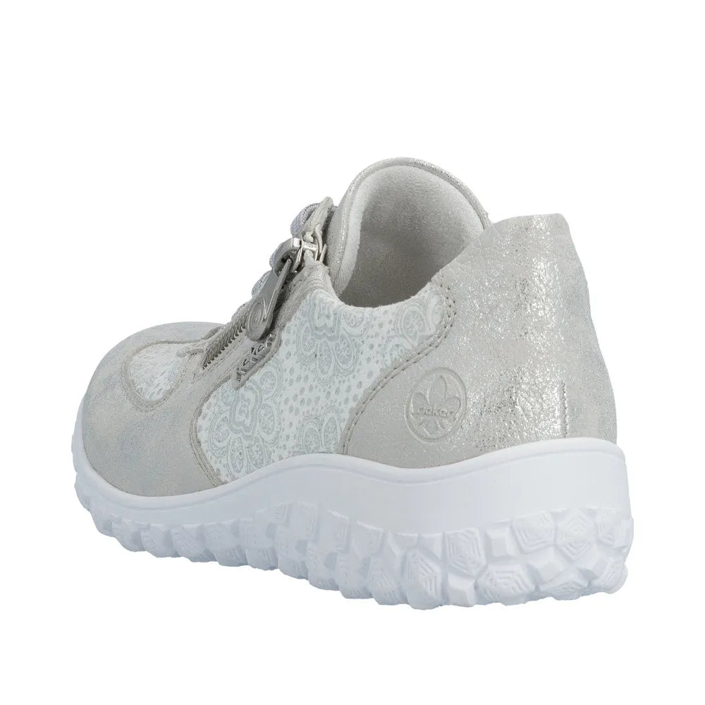 Rieker women's wide fit white and silver sporty shoe with zip, lace-up, textured material, and chunky sole.