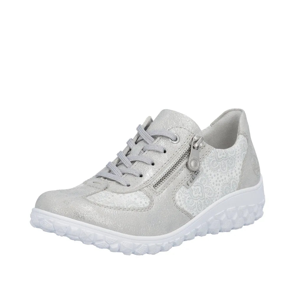 Rieker 59501-90 ladies wide fit white and silver lace-up shoe with zip detail, floral pattern, and textured sole.