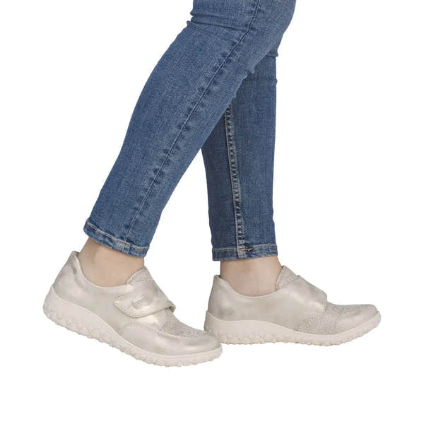 Cream wide-touch fastening shoes with textured material, chunky sole, and ergonomic design.