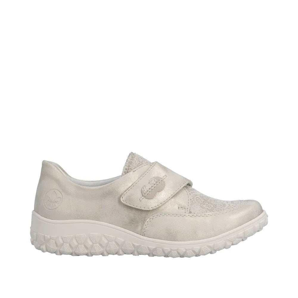 Rieker 59552-62 ladies wide cream touch fastening shoes with textured and smooth material details, cushioned sole, and Velcro strap.
