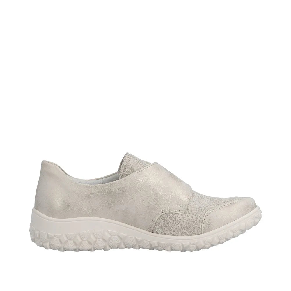 Rieker 59552-62 ladies wide-fit cream touch fastening shoes with decorative side pattern and textured rubber sole.
