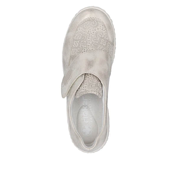 Cream wide-fit ladies shoes with touch-fastening strap, perforated floral design, and suede-like material from Rieker 59552-62.