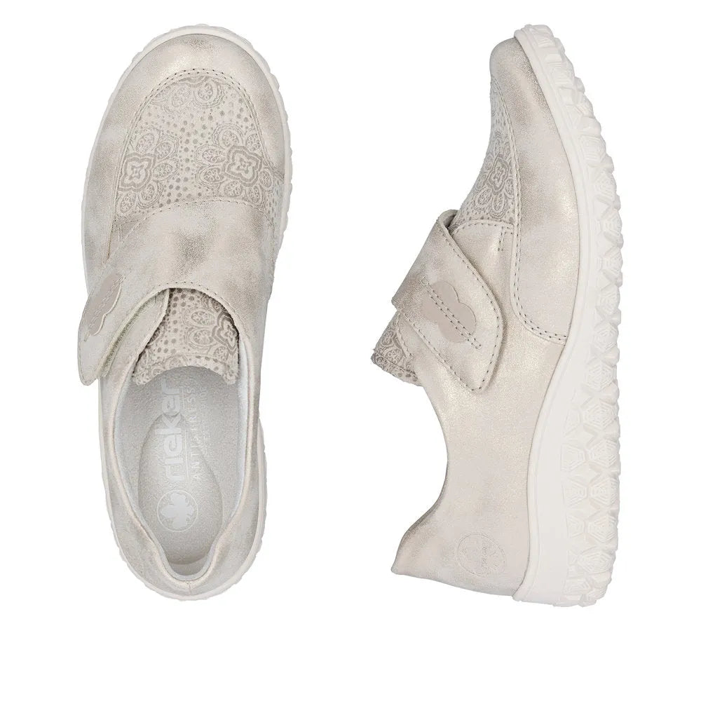 Cream touch fastenings ladies' wide-fit shoes with floral-patterned detailing and cushioned soles.
