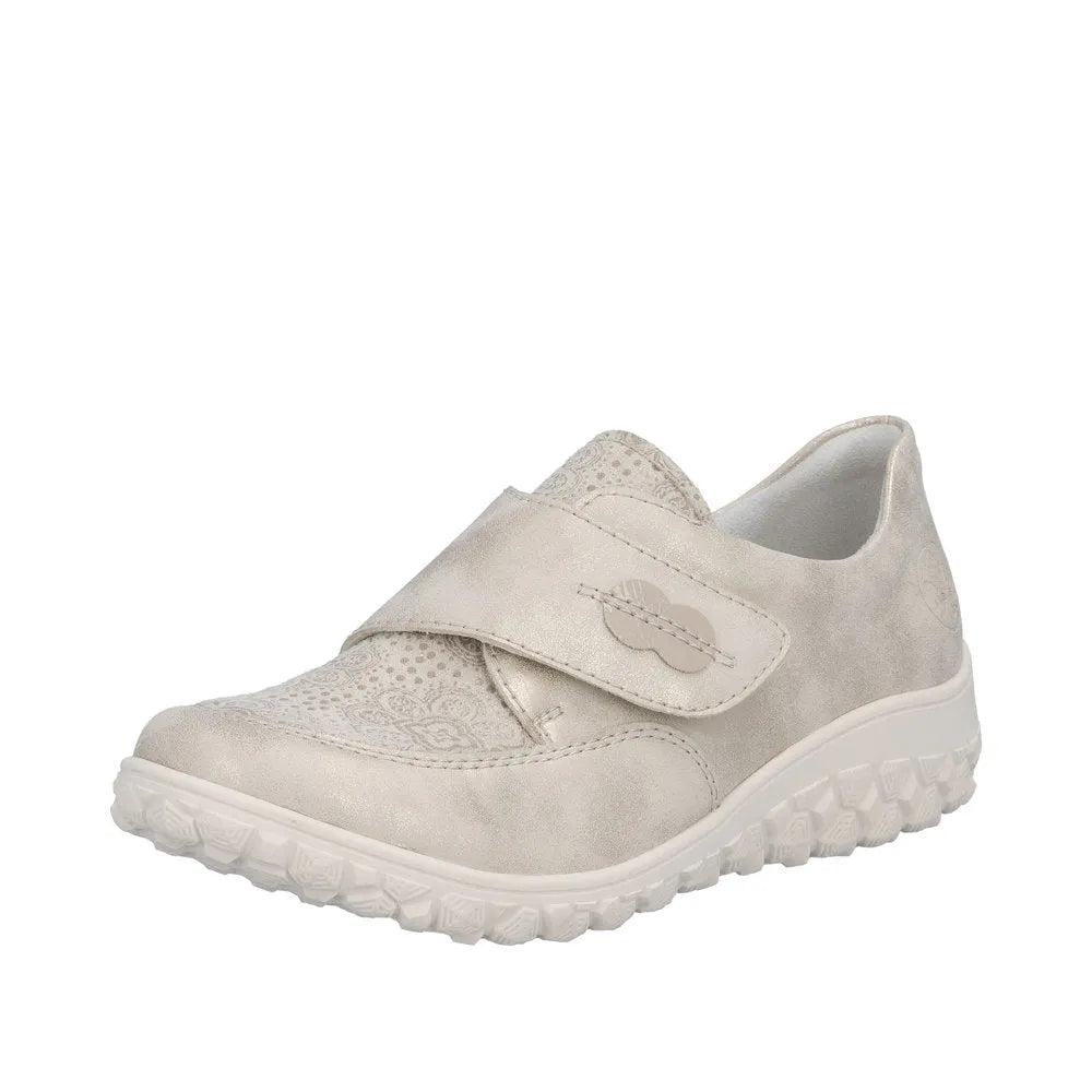 Cream-colored wide fit ladies' shoes with a touch fastener, perforated details, and a textured sole.