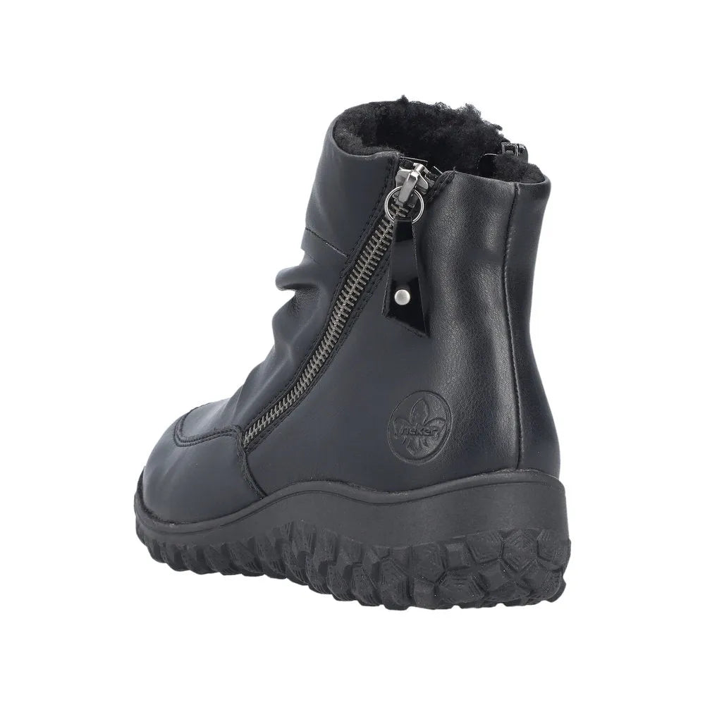 Rieker 59585-01 black ruched women's ankle boots with twin zippers, cushioned sole, and faux fur lining for comfort and style.