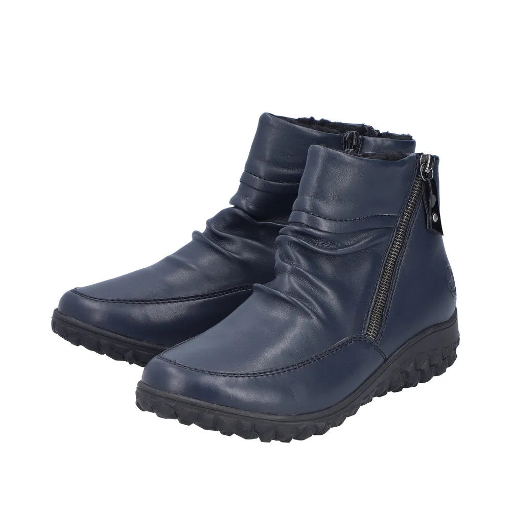 Rieker 59585-14 blue ruched women's ankle boots with twin zippers, faux leather exterior, and comfortable rugged soles.