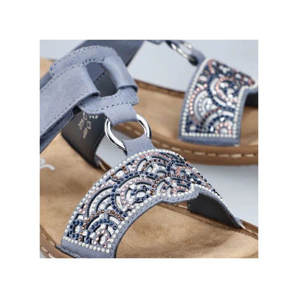 Rieker 608K2-12 women's blue touch fastening mules with embellished beaded strap and comfortable sole.