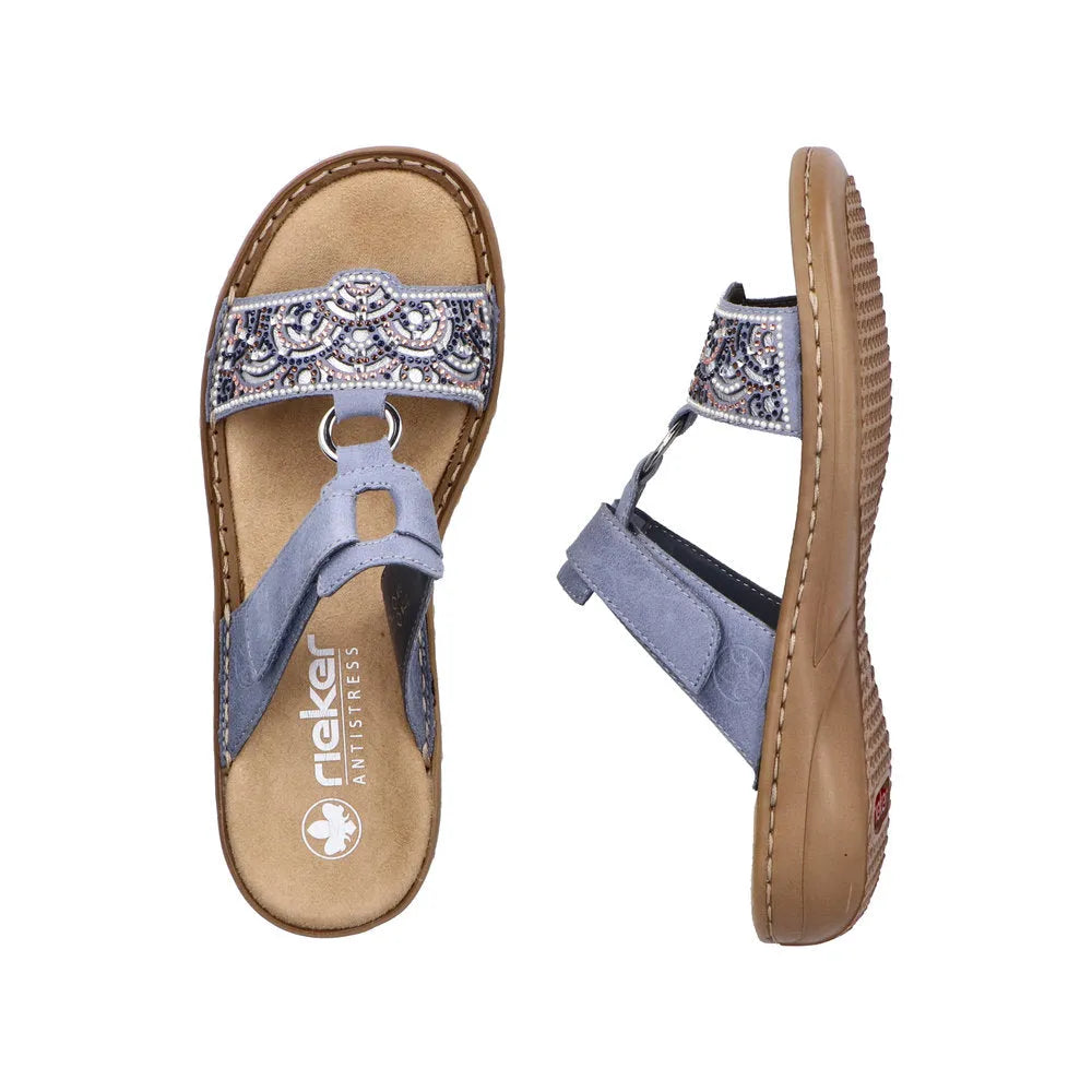 Rieker 608K2-12 ladies blue touch fastening mules with embellished strap, comfortable cushioned insole, and rubber sole.