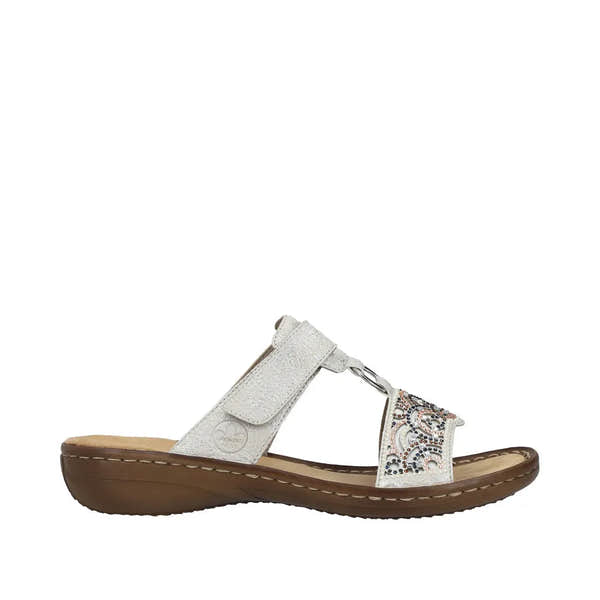 Rieker 608K2-40 women's silver touch fastening mules with decorative beaded strap, cushioned sole, and low wedge heel.