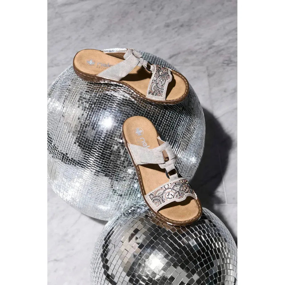 Rieker 608K2-40 women's silver touch fastening mules on disco balls, stylish slip-on sandals with decorative cutouts and embellishments.