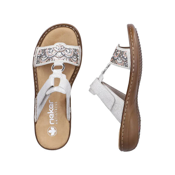 Rieker 608K2-40 women's silver touch fastenings mules with decorative straps and low brown sole.