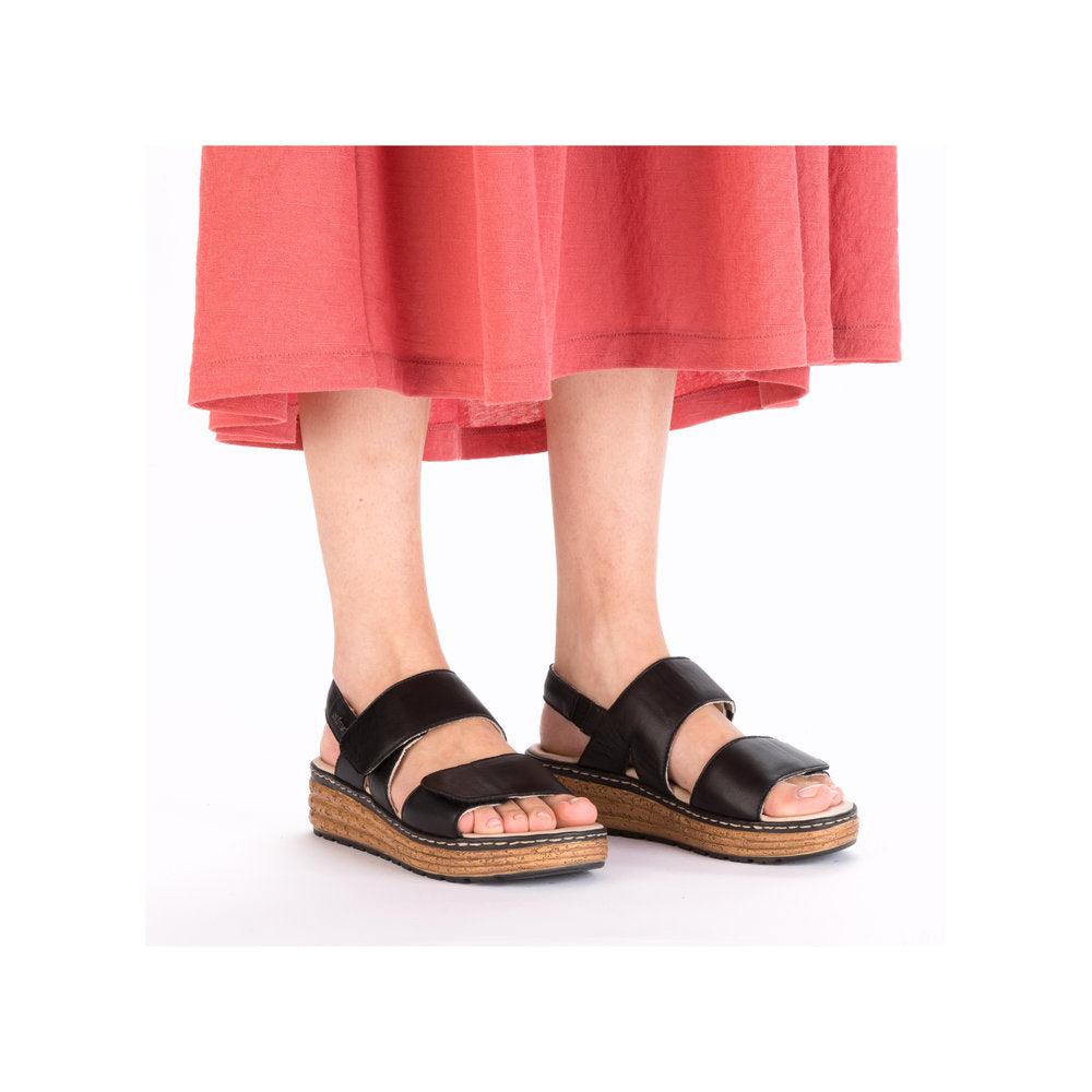Rieker 62761-00 Ladies Black Leather Touch Fastening Sandals with wedge sole and open toe, stylish and comfortable for summer.