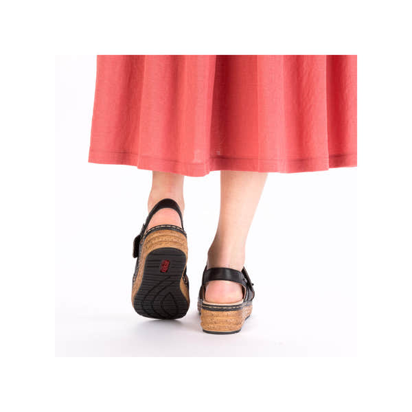 Rieker 62761-00 Women's Black Leather Touch Fastening Sandals with cork wedge heel, back view.