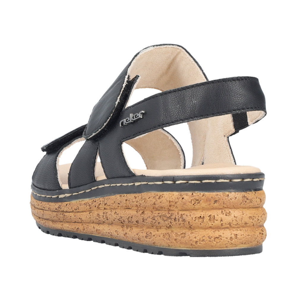 Rieker 62761-00 women's black leather touch fastening sandals with a cork wedge sole and open toe design.