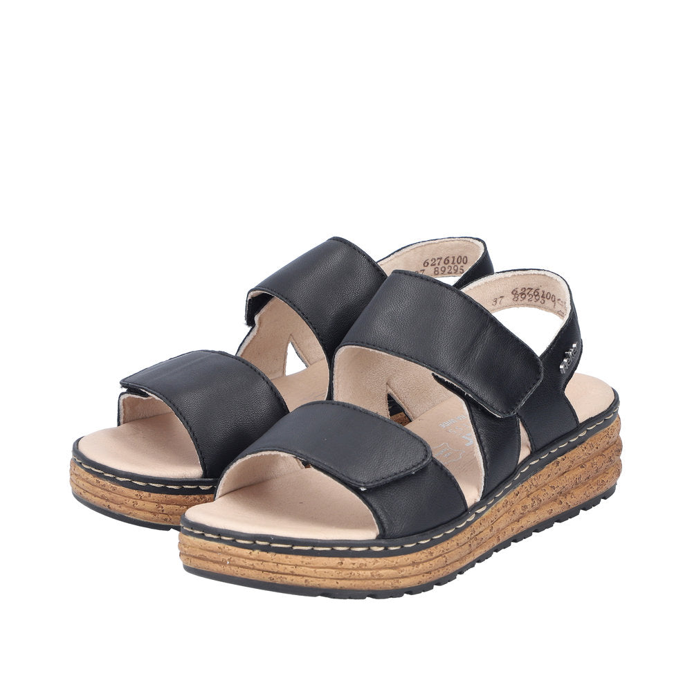 Rieker 62761-00 black leather women's touch fastening sandals with cushioned insole and cork platform sole.