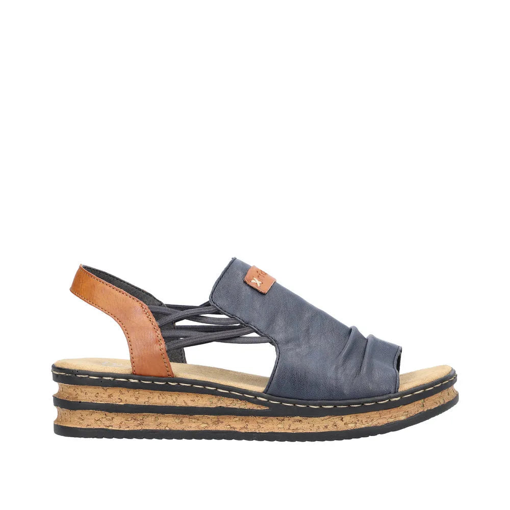 Rieker 62962-14 women's elasticated leather sandal in Pacific Blue and Brown with cork wedge sole and open toe design.