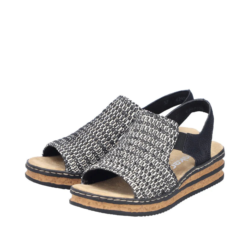 Rieker 62971-00 women's black textile elasticated open-toe sandals with cork footbed and adjustable heel strap.
