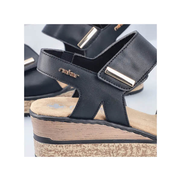 Rieker 63781-00 Ladies Black Touch Fastening Wedge Sandals with ankle straps and metallic accents.