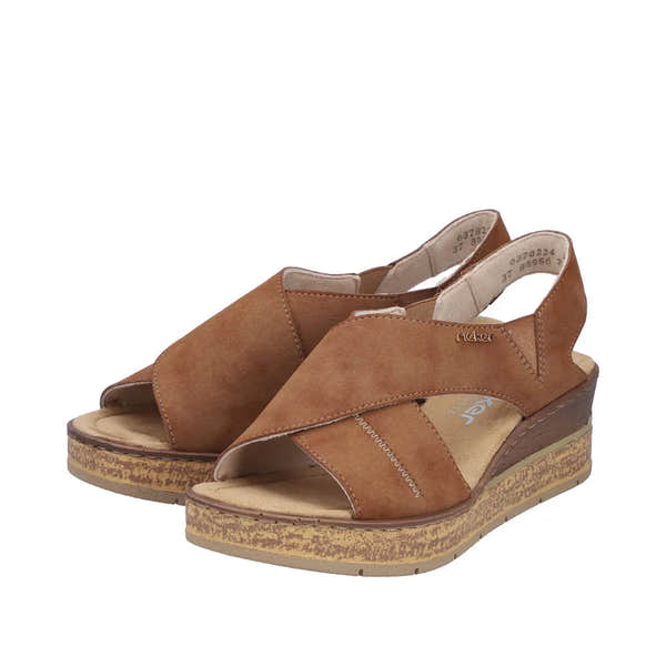 Rieker 63782-24 women's brown elasticated sandals with cork wedge heel, open toe, and adjustable slingback strap.