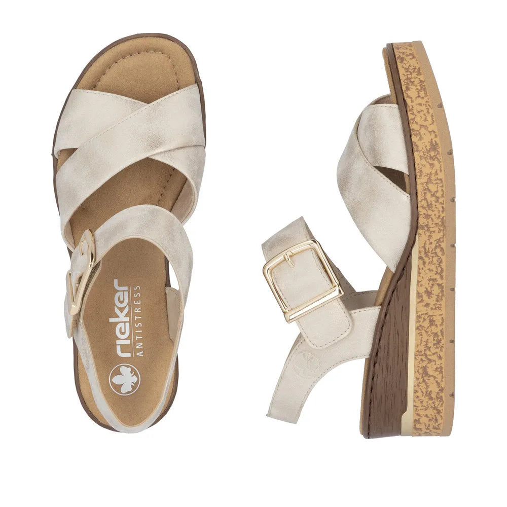 Rieker 63795-60 women's muschel buckle sandals with beige crisscross straps, cushioned footbed, and wood-textured platform sole.